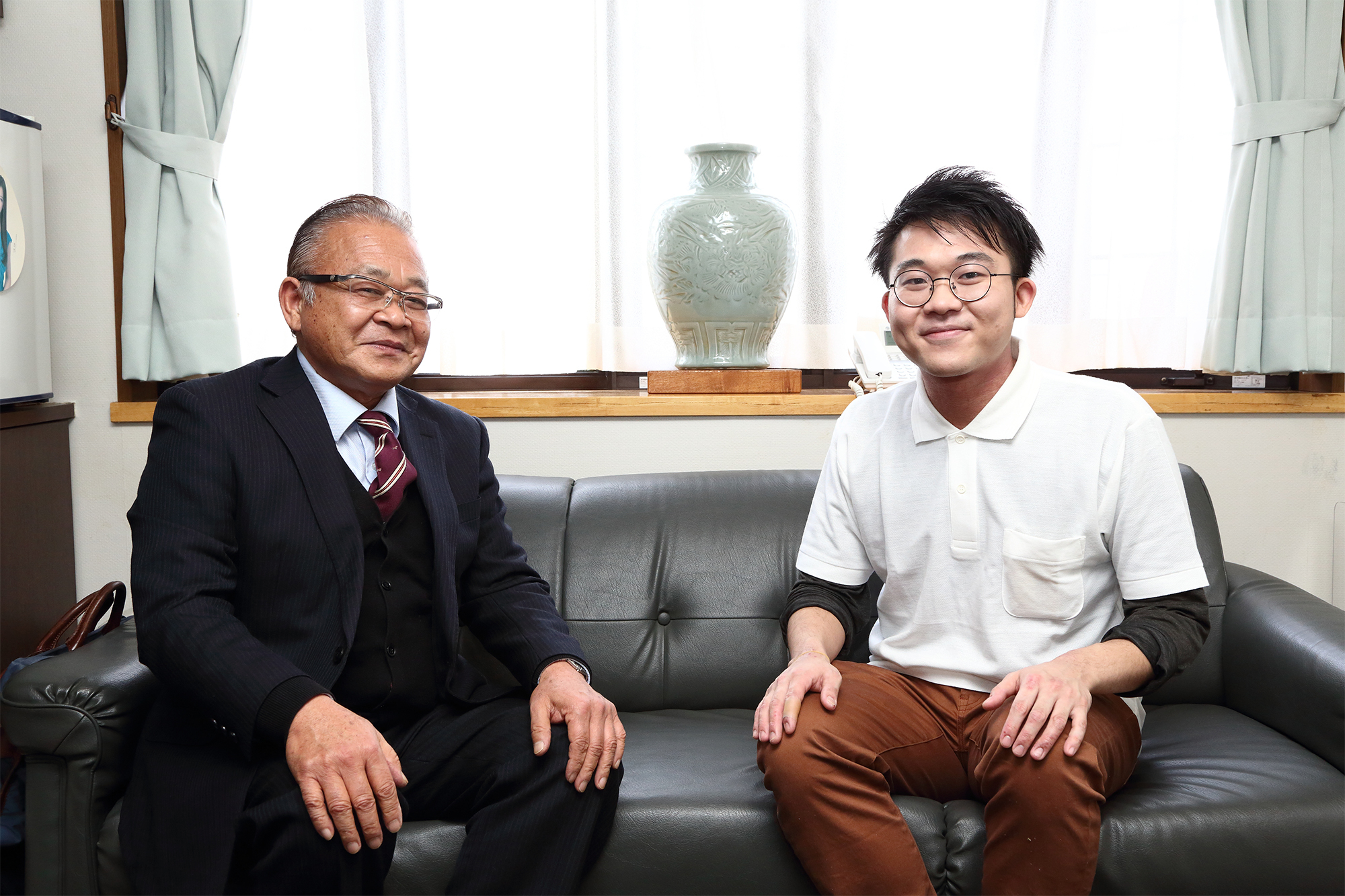 写真：代表取締役 上田 巌とスタッフ